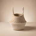 Nubrel woven jute and cotton belly basket, empty, on a warm neutral background