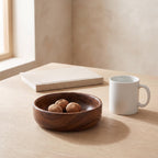 Barca bowl next to a coffee mug and a book to show its real size