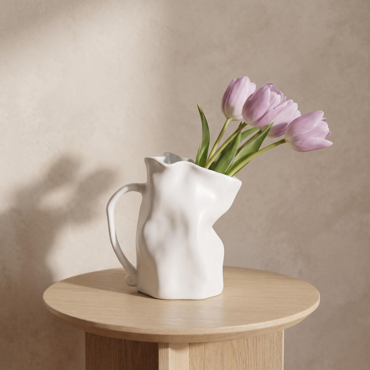 Plica crumpled ceramic jug vase in white with lilac tulips
