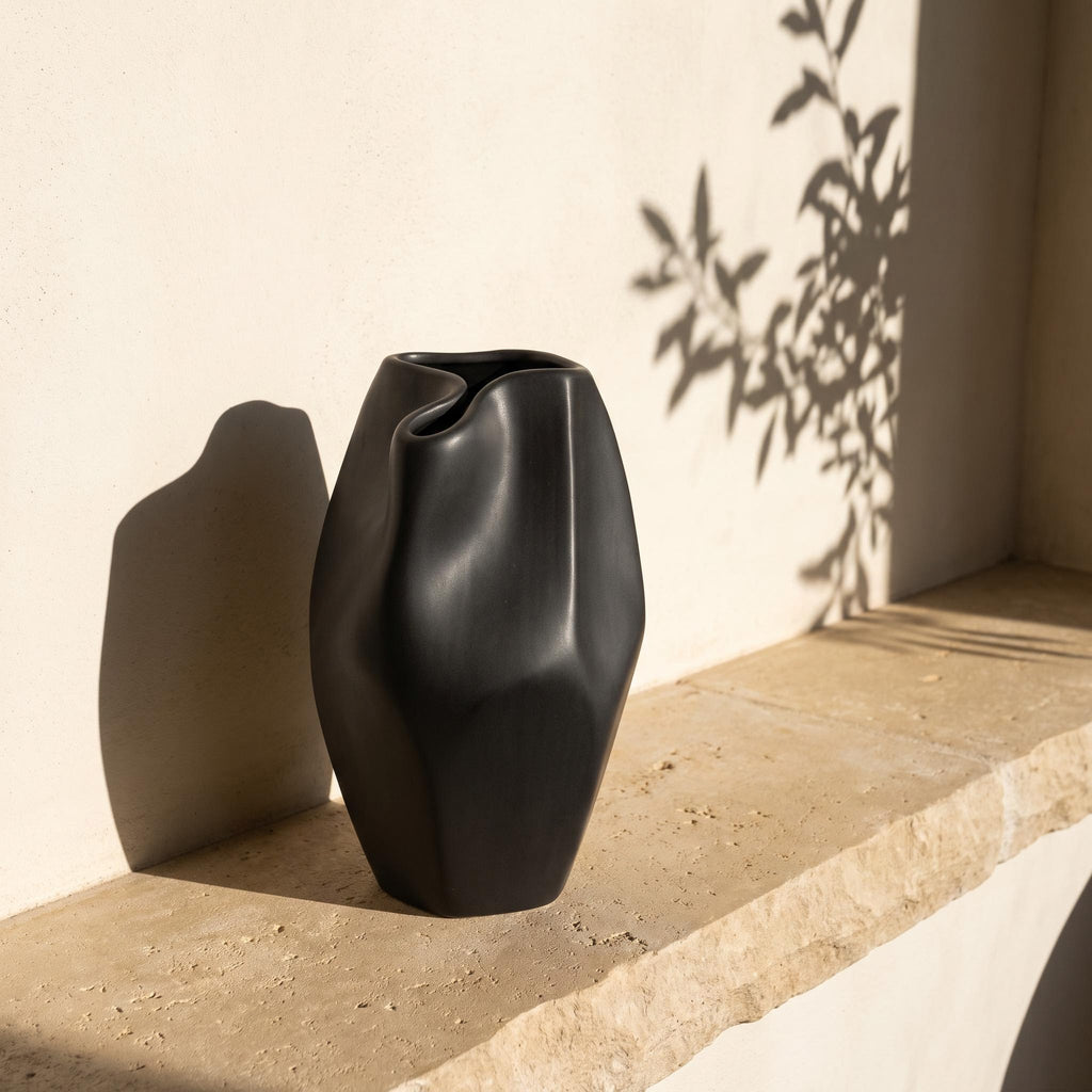 Alven vase on a limestone windowsill with afternoon shadows