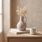 Anfo jug next to a coffee mug and a book to show its real size