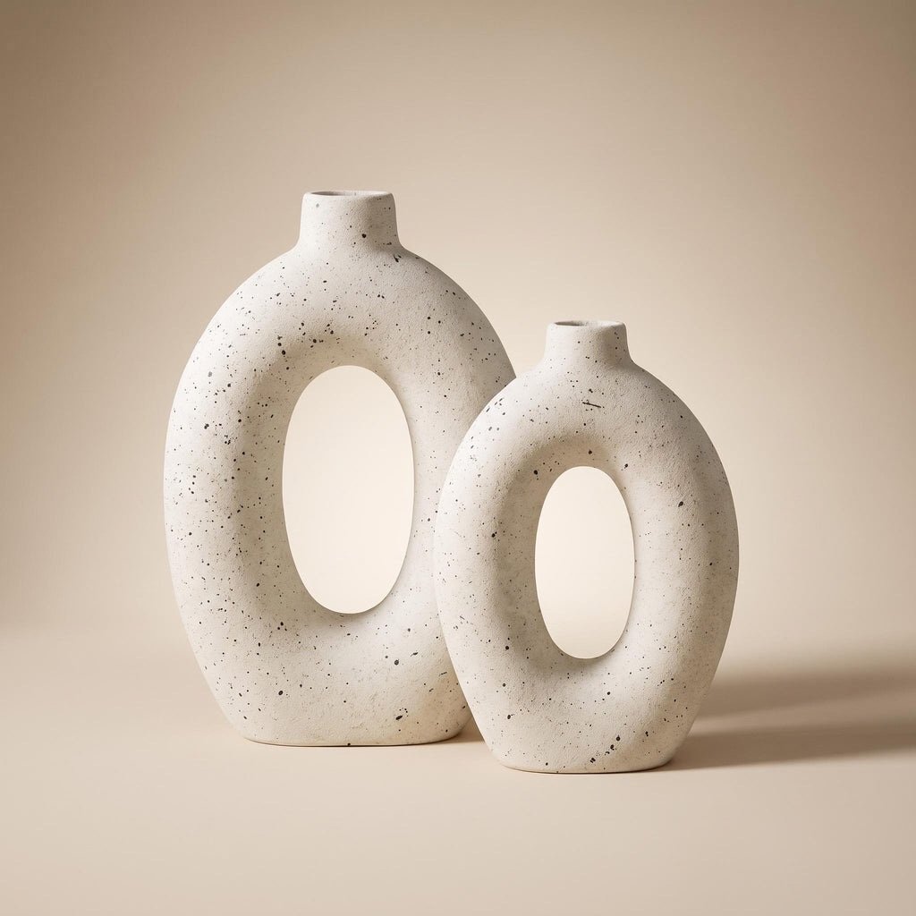 Alburo pair of speckled ceramic ring vases, empty, on a warm neutral background