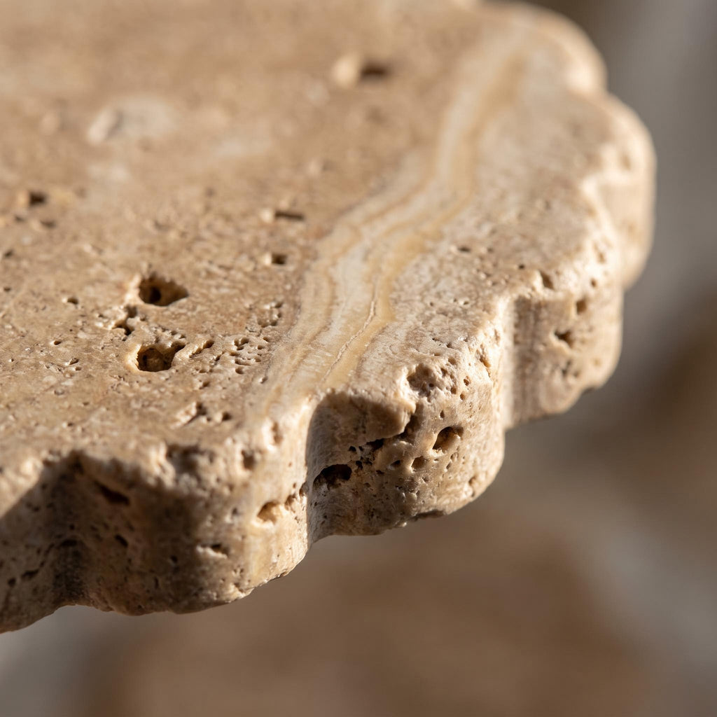 Close-up of the pitting and mineral veining of the unsealed travertine coaster