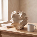 Sorel vase next to a coffee mug and a book to show its real size