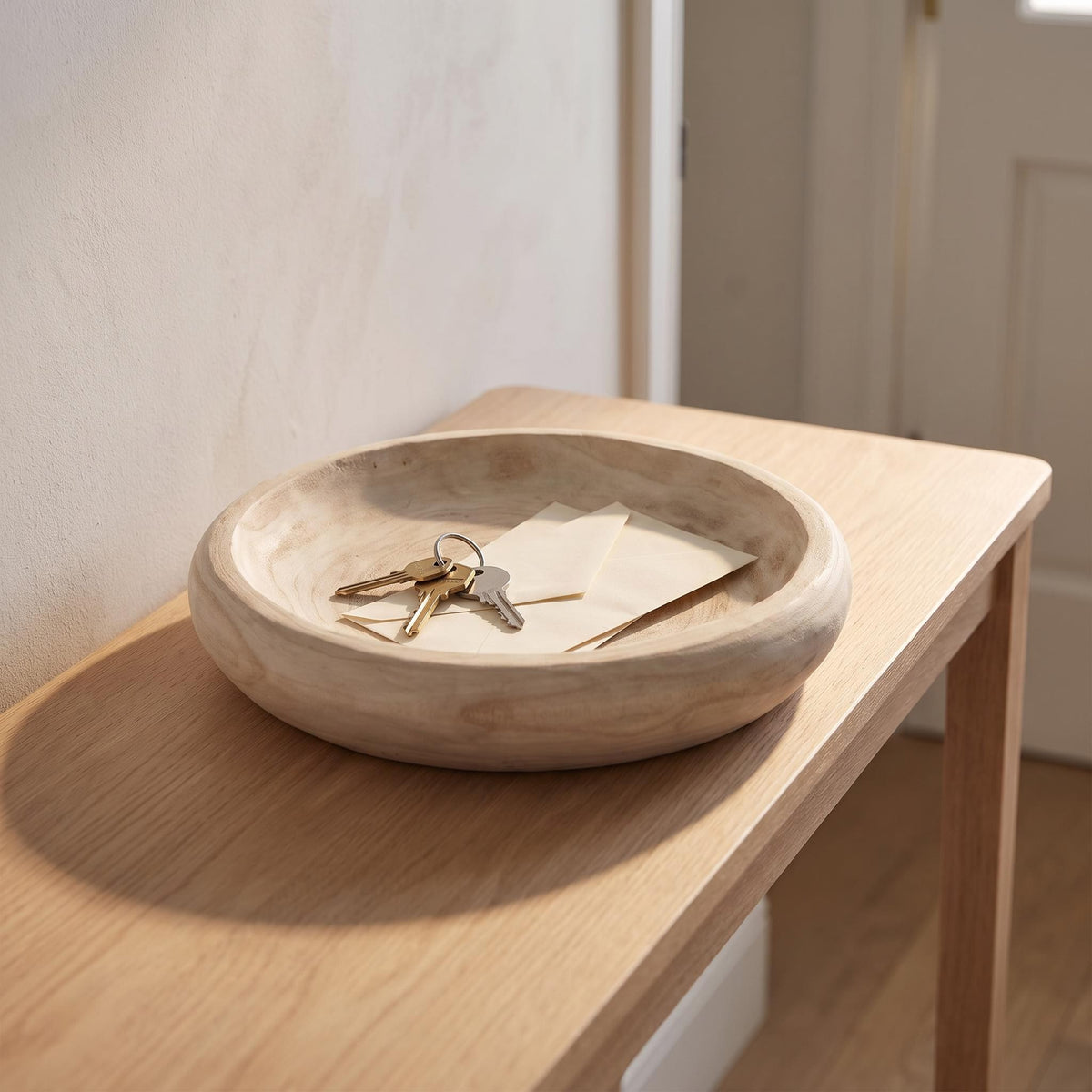 Velto bowl on an entry console holding keys and letters