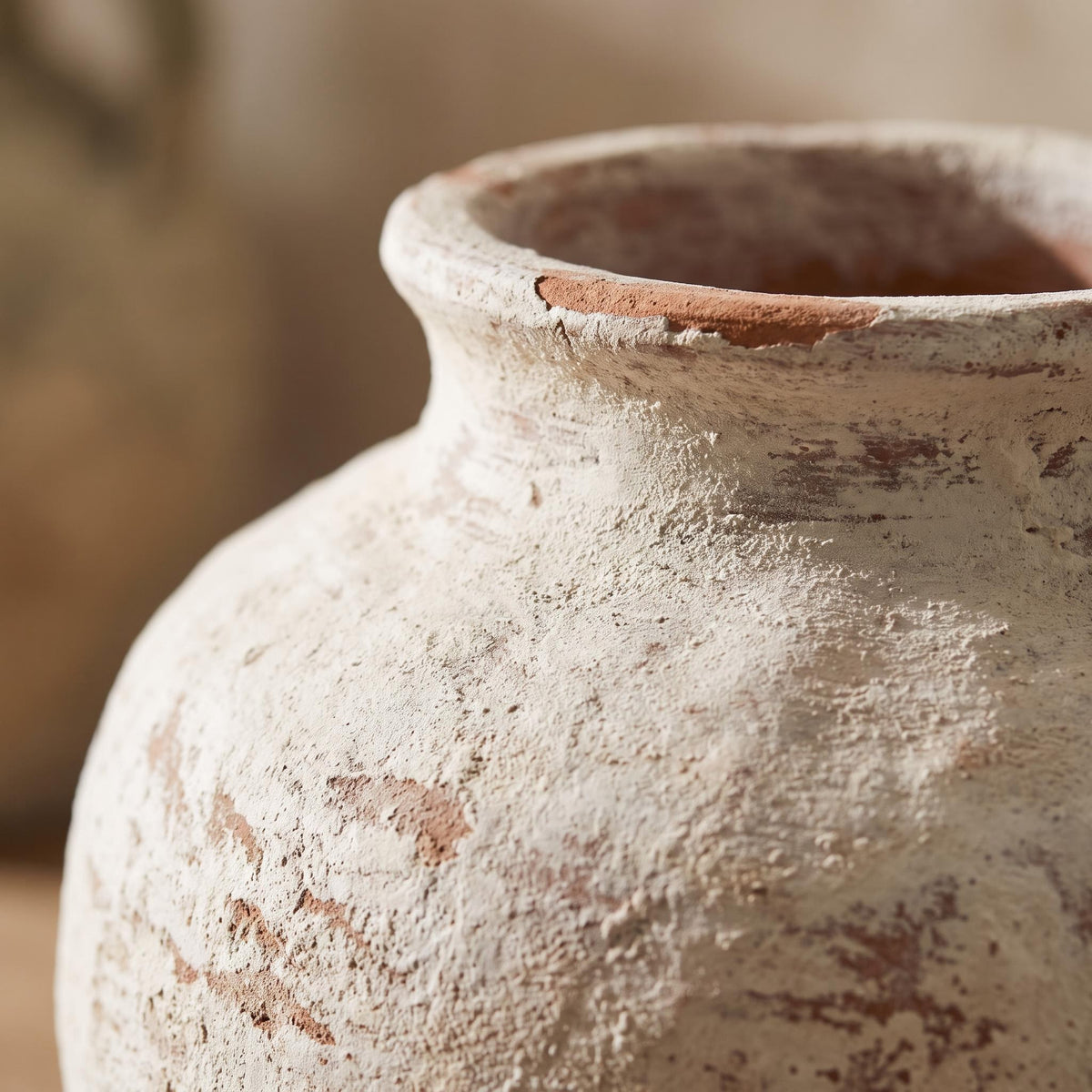 Close-up of the chalky painted finish and clay texture at the rim of the Bianca vase