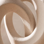 Close-up of the matte speckled white ceramic of the Lazo vases