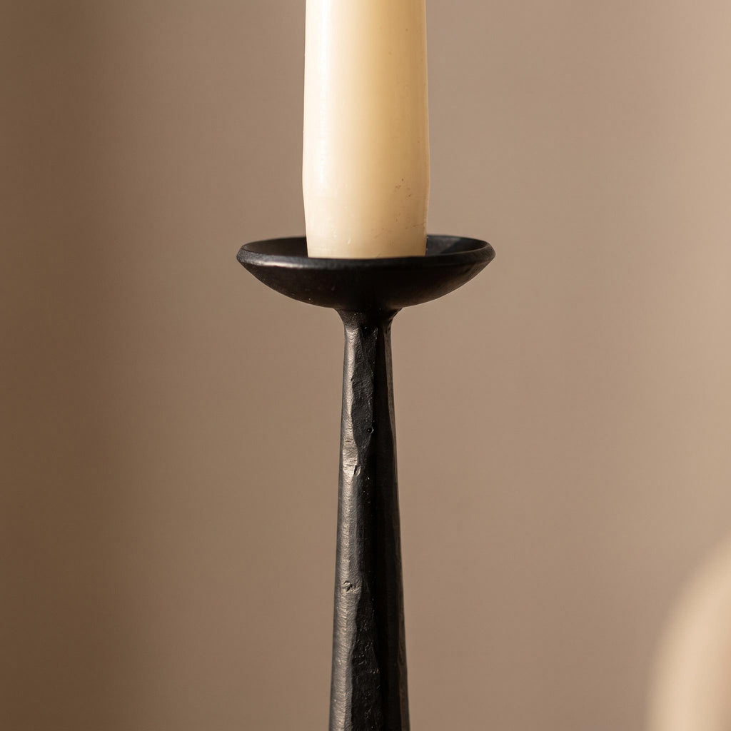 Close-up of a forged iron stem and cup holder of the Kebro candelabra