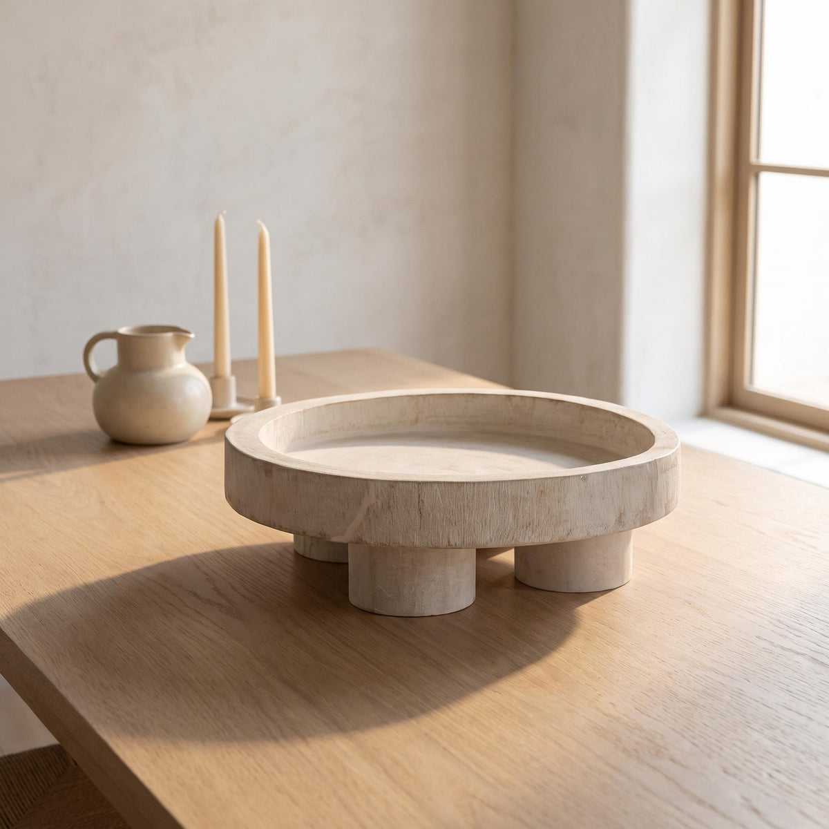 Nuko tray empty at the centre of a pale oak dining table