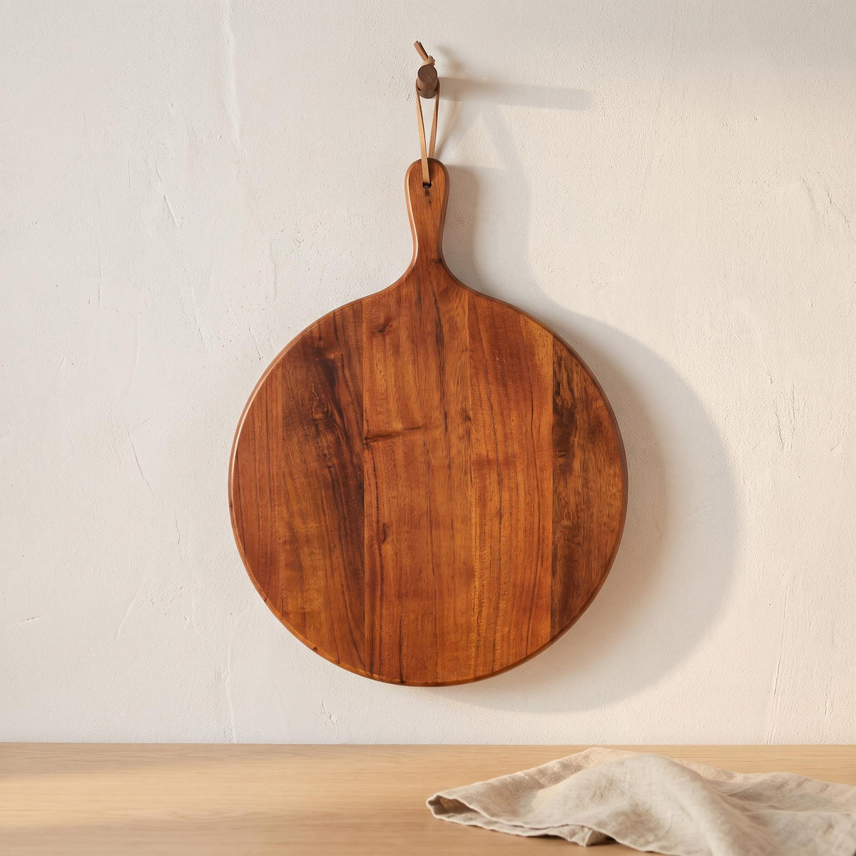 Albo board hanging from its leather cord on a kitchen wall