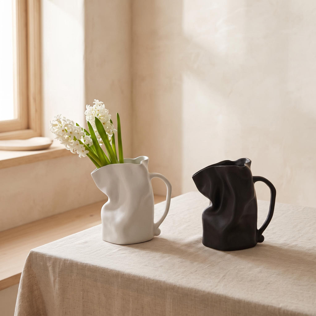 Plica jug vases in white and black on a linen table