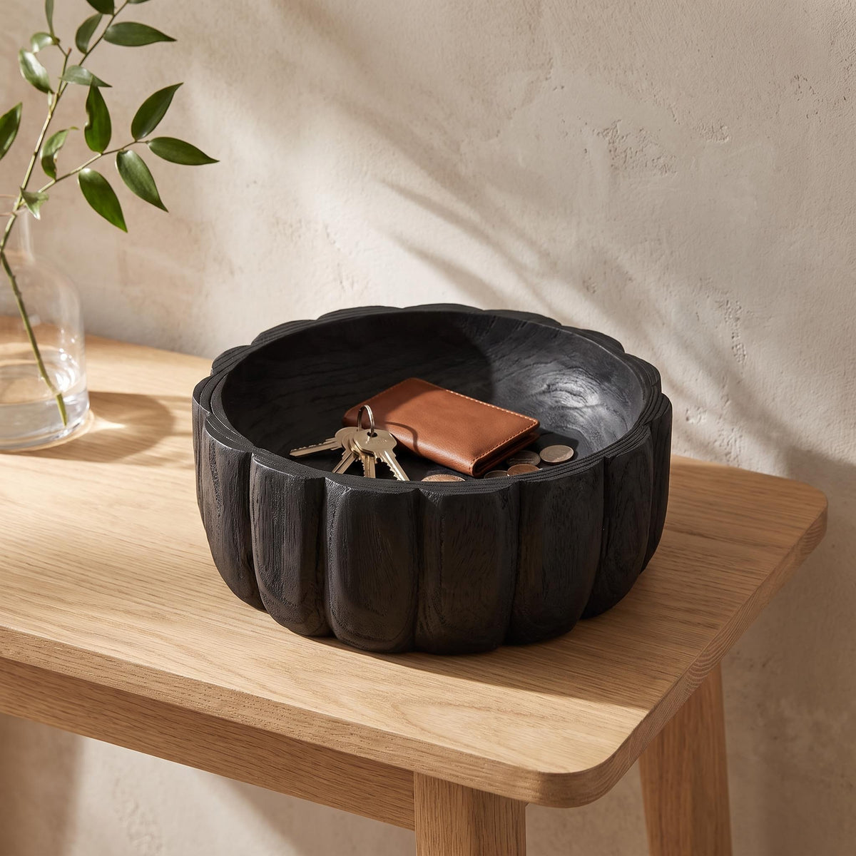 Ondel bowl on a console holding keys and a card holder