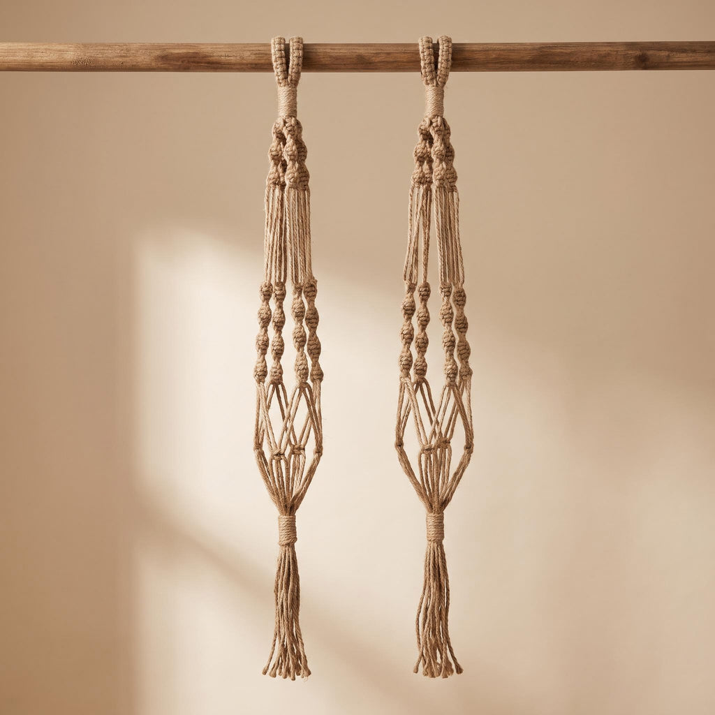 Rema pair of hand-knotted jute rope plant hangers, empty, on a warm neutral background
