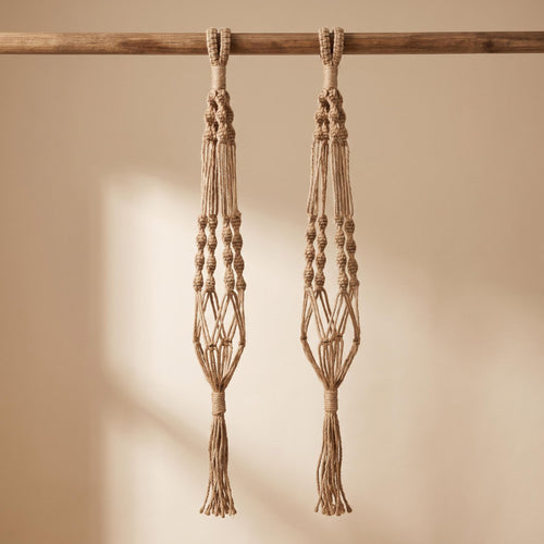 Rema pair of hand-knotted jute rope plant hangers, empty, on a warm neutral background